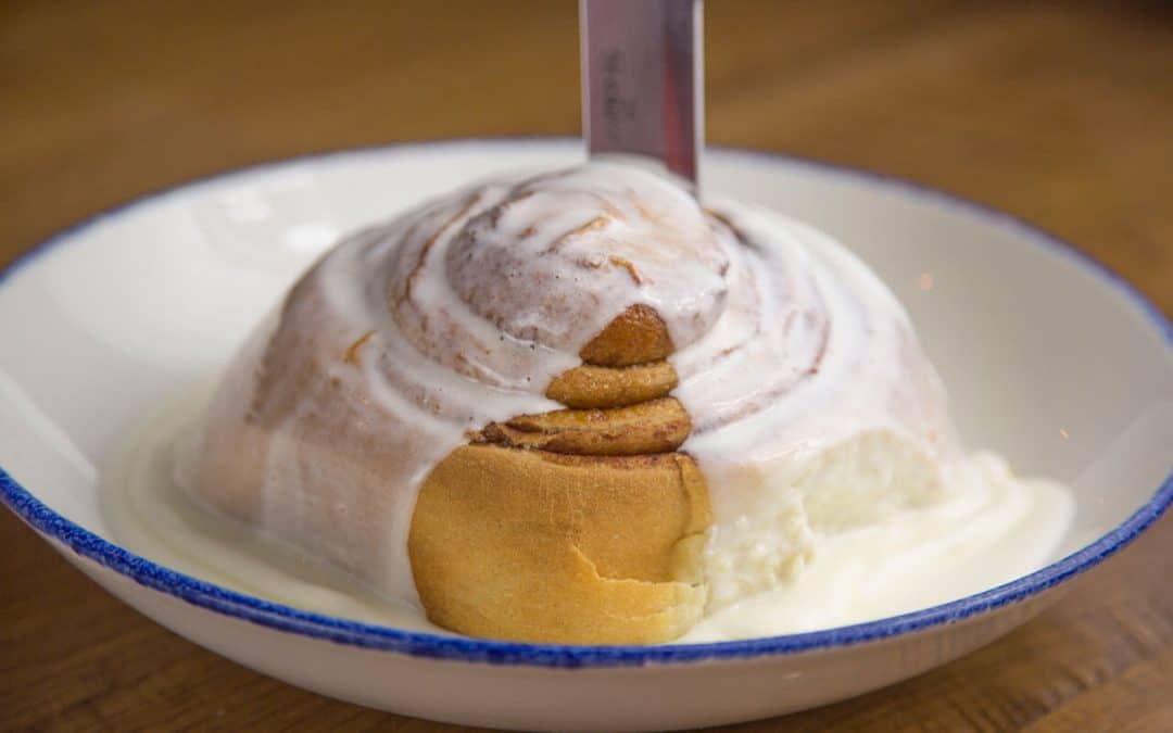 cinnamon roll covered in icing