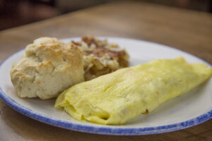 omelet with biscuit and hash browns